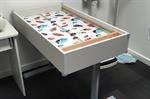 Child health clinic nurses benefit from height-adjustable table